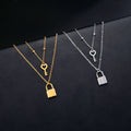 Collier double avec pendentif clef et cadenas or