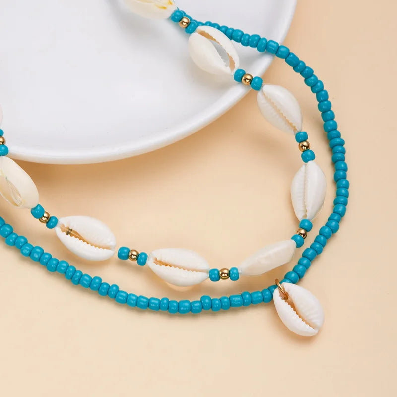 Double collier coquillage cauri turquoise