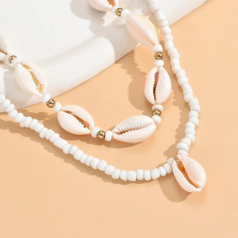 Double collier coquillage cauri blanc