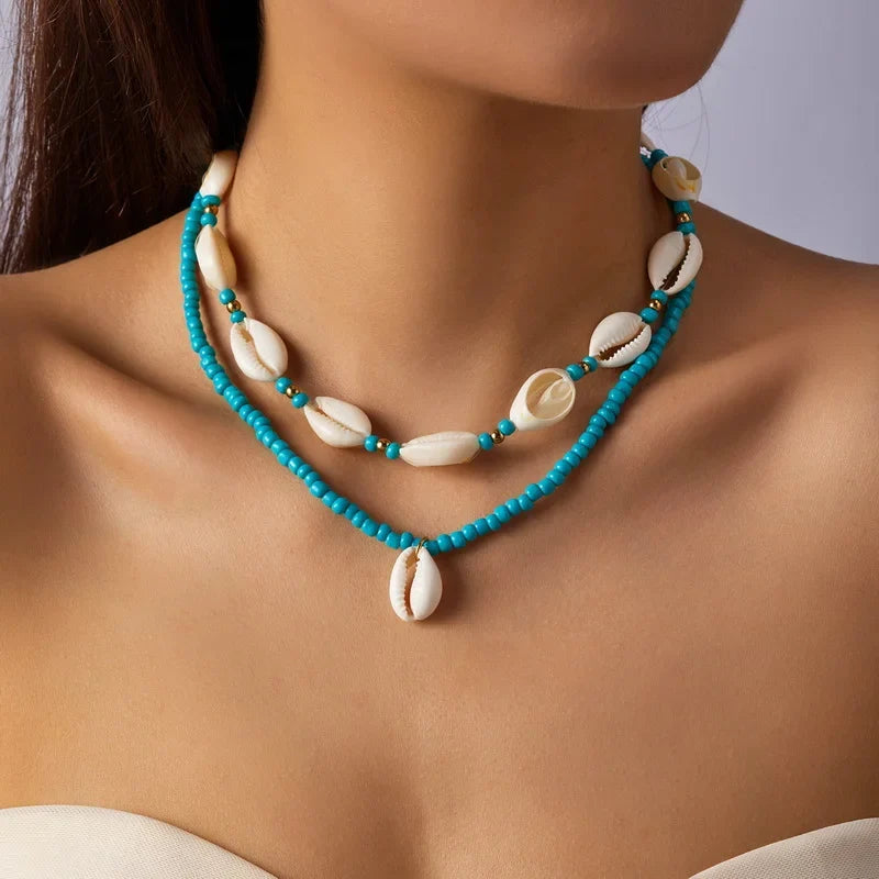 Double collier coquillage cauri turquoise