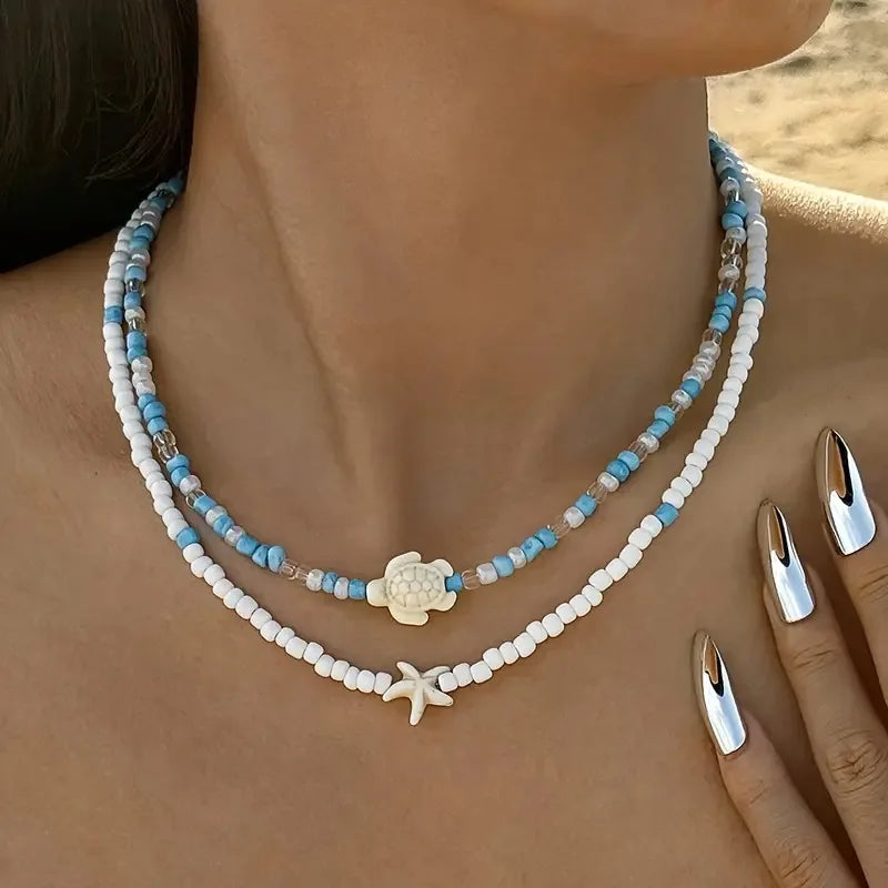 Double collier coquillage et perles colorées bleu tortue