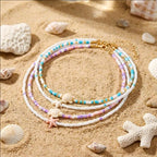 Double collier coquillage et perles colorées bleu tortue