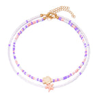 Double collier coquillage et perles colorées rose