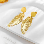 Grandes boucles d'oreilles plume stylisées