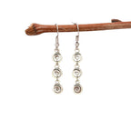 Longues boucles d'oreilles pendantes spirale