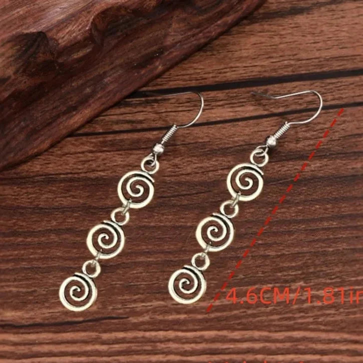 Longues boucles d'oreilles pendantes spirale
