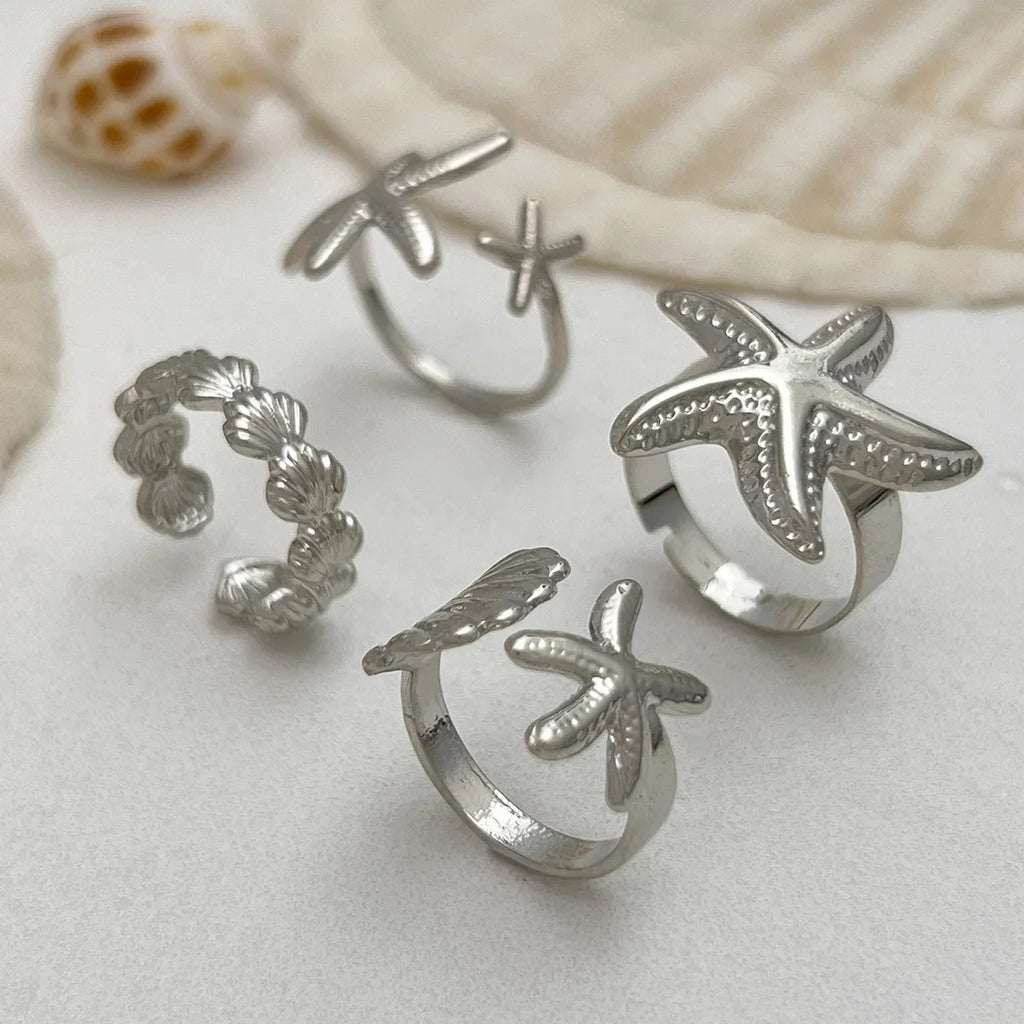 Lot de 4 bagues coquillage et étoiles de mer argent