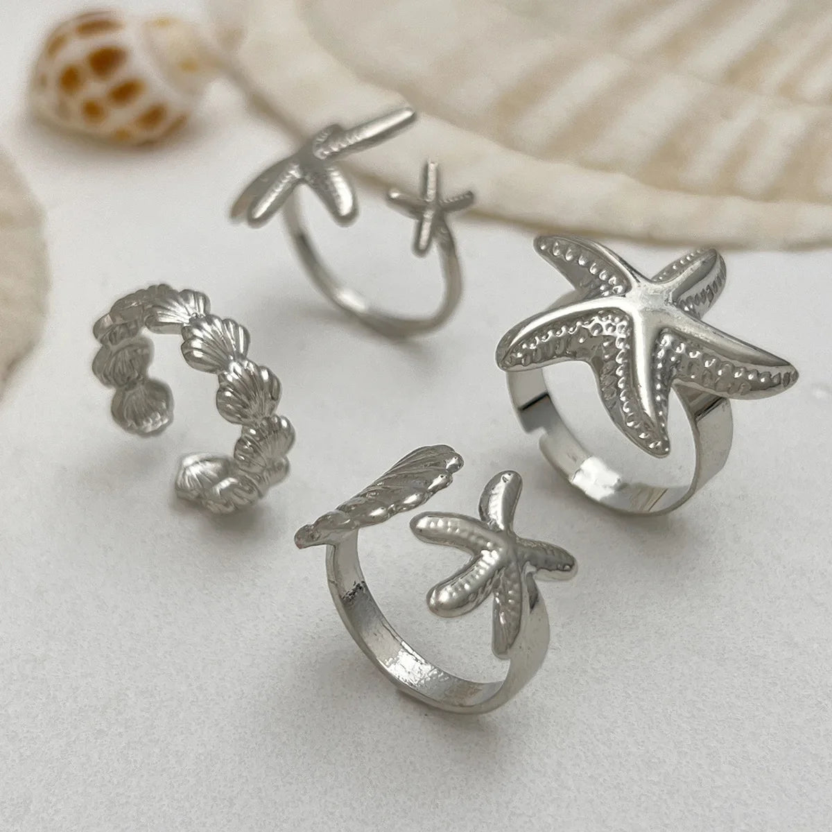 Lot de 4 bagues coquillage et étoiles de mer argent