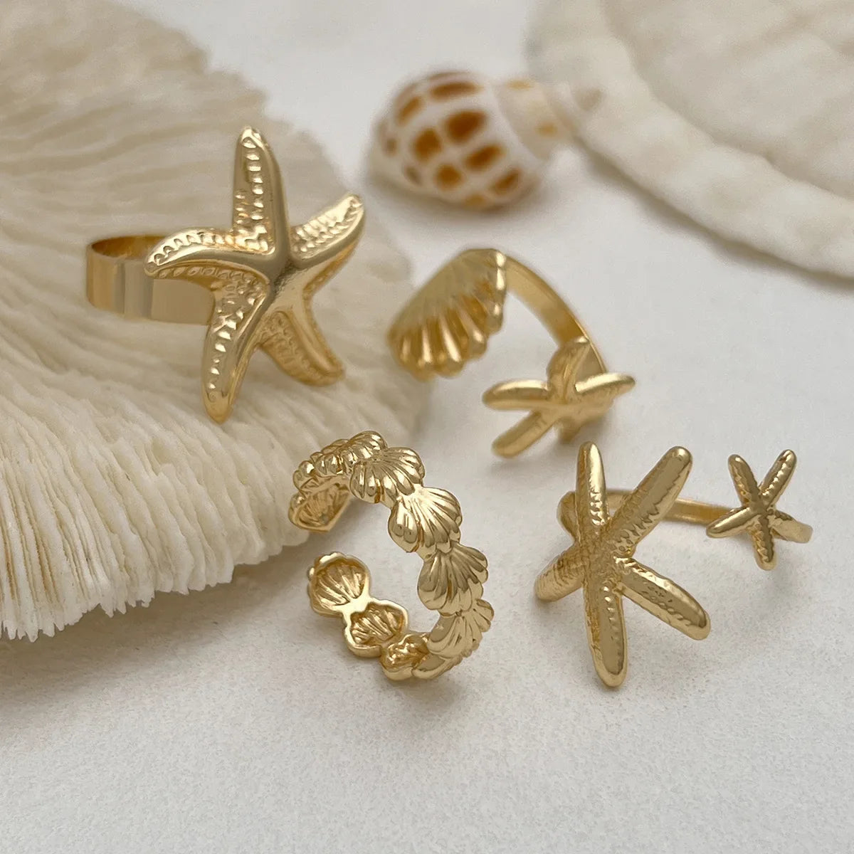 Lot de 4 bagues coquillage et étoiles de meror