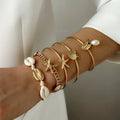Lot de 5 bracelets coquillage et étoile dorés